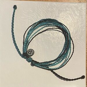 Black, light blue, and blue Pura Vida bracelet.